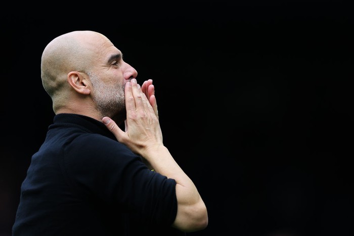 Pep Guardiola LIVERPOOL, ENGLAND - MAY 14: Josep 'Pep' Guardiola, manager of Manchester City, celebrates with the away support following the Premier League match between Everton FC and Manchester City at Goodison Park on May 14, 2023 in Liverpool, England. (Photo by James Gill - Danehouse/Getty Images)