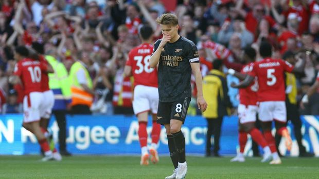 Soccer Football - Premier League - Nottingham Forest v Arsenal - The City Ground, Nottingham, Britain - May 20, 2023  Arsenal's Martin Odegaard reacts after Nottingham Forest's Taiwo Awoniyi scores their first goal REUTERS/Carl Recine EDITORIAL USE ONLY. No use with unauthorized audio, video, data, fixture lists, club/league logos or 'live' services. Online in-match use limited to 75 images, no video emulation. No use in betting, games or single club /league/player publications.  Please contact your account representative for further details.