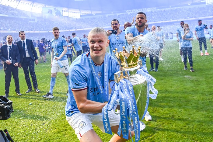 Manchester City MANCHESTER, ENGLAND - MAY 21: Erling Haaland of Manchester City celebrates with the Premier League trophy after the Premier League match between Manchester City and Chelsea FC at Etihad Stadium on May 21, 2023 in Manchester, England. (Photo by Michael Regan/Getty Images)