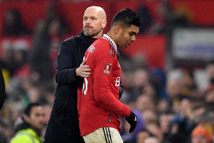 Manchester Uniteds Dutch manager Erik ten Hag (L) gestures to Manchester Uniteds Brazilian midfielder Casemiro (R) as he is substituted during the English FA Cup fourth round football match between Manchester United and Reading at Old Trafford in Manchester, north west England, on January 28, 2023. - RESTRICTED TO EDITORIAL USE. No use with unauthorized audio, video, data, fixture lists, club/league logos or live services. Online in-match use limited to 120 images. An additional 40 images may be used in extra time. No video emulation. Social media in-match use limited to 120 images. An additional 40 images may be used in extra time. No use in betting publications, games or single club/league/player publications. (Photo by Oli SCARFF / AFP) / RESTRICTED TO EDITORIAL USE. No use with unauthorized audio, video, data, fixture lists, club/league logos or live services. Online in-match use limited to 120 images. An additional 40 images may be used in extra time. No video emulation. Social media in-match use limited to 120 images. An additional 40 images may be used in extra time. No use in betting publications, games or single club/league/player publications. / RESTRICTED TO EDITORIAL USE. No use with unauthorized audio, video, data, fixture lists, club/league logos or live services. Online in-match use limited to 120 images. An additional 40 images may be used in extra time. No video emulation. Social media in-match use limited to 120 images. An additional 40 images may be used in extra time. No use in betting publications, games or single club/league/player publications. (Photo by OLI SCARFF/AFP via Getty Images)
