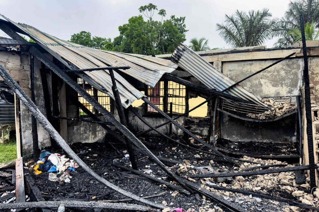 View of the school dormitory that caught fire and left at least 19 people dead in Mahdia, Guyana on May 22, 2023. At least 19 people, most of them youths, were killed and several injured Sunday in a school dormitory fire in Guyana, the government said in a statement, with the nation's president calling it a 