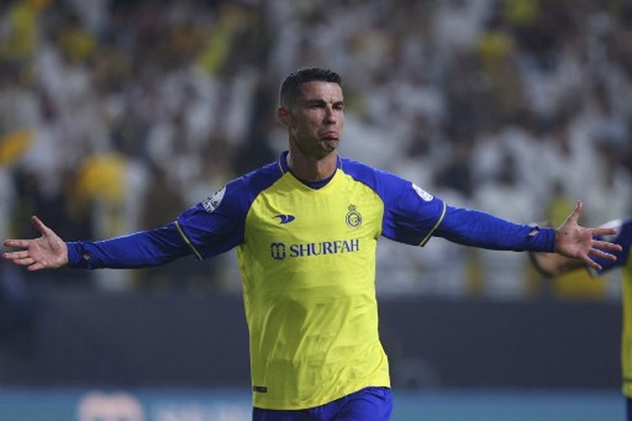 Nassrs Portuguese forward Cristiano Ronaldo reacts after scoring during the Saudi Pro League football match between Al-Nassr and Al-Shabab at the al-Awwal Park Stadium in Riyadh on May 23, 2023. (Photo by Fayez NURELDINE / AFP)