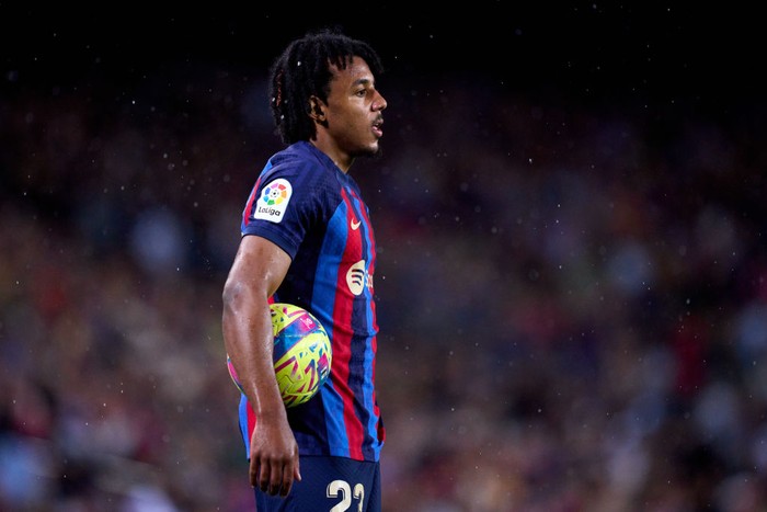 BARCELONA, SPAIN - APRIL 29: Jules Kounde of FC Barcelona carries the ball as he looks on during the LaLiga Santander match between FC Barcelona and Real Betis at Spotify Camp Nou on April 29, 2023 in Barcelona, Spain. (Photo by Alex Caparros/Getty Images)