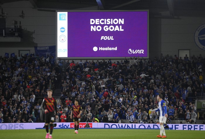 Soccer Football - Premier League - Brighton & Hove Albion v Manchester City - The American Express Community Stadium, Brighton, Britain - May 24, 2023 The big screen displays a VAR review message NO GOAL for Manchester Citys Erling Braut Haaland REUTERS/Toby Melville EDITORIAL USE ONLY. No use with unauthorized audio, video, data, fixture lists, club/league logos or live services. Online in-match use limited to 75 images, no video emulation. No use in betting, games or single club /league/player publications.  Please contact your account representative for further details.