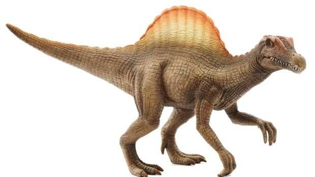 Spinosaurus toy isolated on white