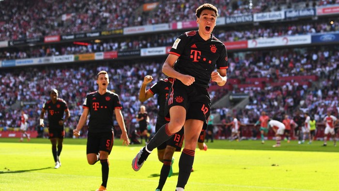 27 May 2023, North Rhine-Westphalia, Cologne: Soccer: Bundesliga, 1. FC Köln - Bayern München, Matchday 34, RheinEnergieStadion. Bayerns Jamal Musiala (r) celebrates after scoring the goal to make it 2:1. IMPORTANT NOTICE: In accordance with the regulations of the DFL Deutsche Fußball Liga and the DFB Deutscher Fußball-Bund, it is prohibited to use or have used photographs taken in the stadium and/or of the match in the form of sequence pictures and/or video-like photo series. Photo: Marius Becker/dpa (Photo by Marius Becker/picture alliance via Getty Images)