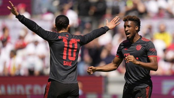 Bayern Munich Bayerns Kingsley Coman, right, celebrates after scoring his sides opening goal besides team mate Leroy Sane during the German Bundesliga soccer match between 1. FC Cologne and FC Bayern Munich in Cologne, Germany, Saturday, May 27, 2023. (AP Photo/Matthias Schrader)