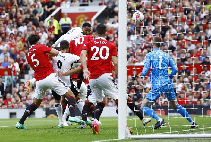 Soccer Football - Premier League - Manchester United v Fulham - Old Trafford, Manchester, Britain - May 28, 2023 Fulhams Kenny Tete scores their first goal Action Images via Reuters/Andrew Boyers EDITORIAL USE ONLY. No use with unauthorized audio, video, data, fixture lists, club/league logos or live services. Online in-match use limited to 75 images, no video emulation. No use in betting, games or single club /league/player publications.  Please contact your account representative for further details.