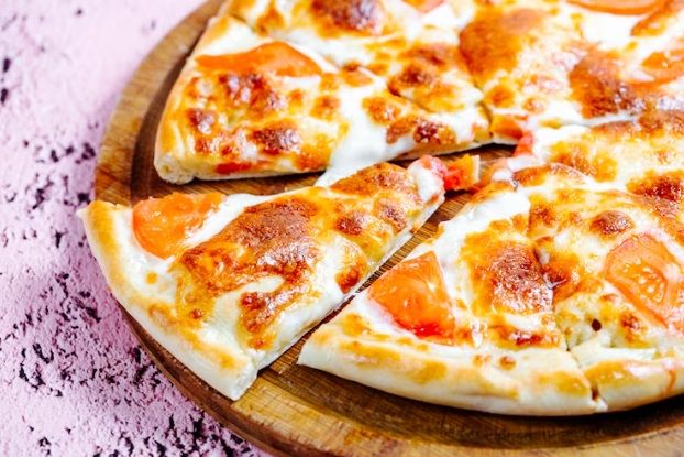 Ilustrasi pizza. /Foto: Freepik.com/Stockking.