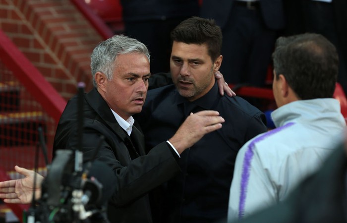 MANCHESTER, ENGLAND - AUGUST 27:  Manager Jose Mourinho of Manchester United greets Manager Mauricio Pochettino of Tottenham Hotspur ahead of the Premier League match between Manchester United and Tottenham Hotspur at Old Trafford on August 27, 2018 in Manchester, United Kingdom.  (Photo by Matthew Peters/Manchester United via Getty Images)