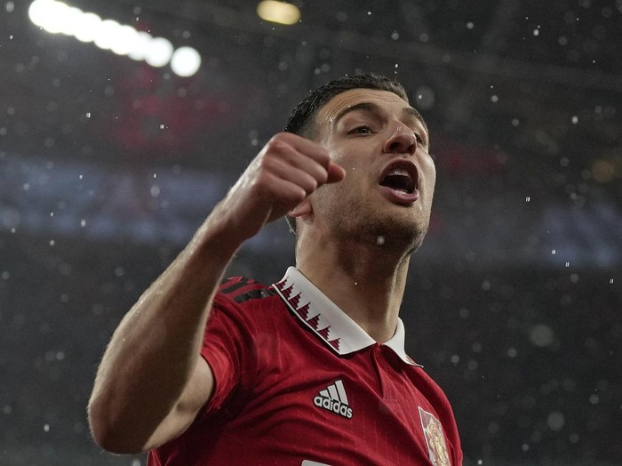 Manchester Uniteds Diogo Dalot celebrates after his team won a penalty shootout at the end of the English FA Cup semifinal soccer match between Brighton and Hove Albion and Manchester United at Wembley Stadium in London, Sunday, April 23, 2023. (AP Photo/Alastair Grant)