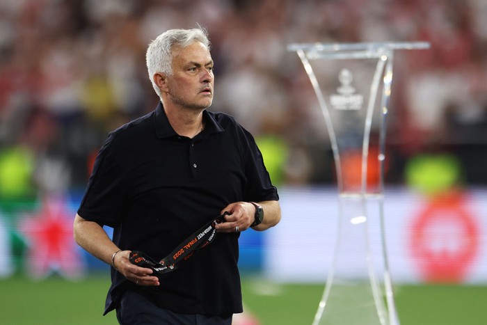 BUDAPEST, HUNGARY - MAY 31: Jose Mourinho, Head Coach of AS Roma, removes their runners up medal after collecting it from Aleksander Ceferin, President of UEFA, (not pictured) after defeat to Sevilla FC in the penalty shoot out during the UEFA Europa League 2022/23 final match between Sevilla FC and AS Roma at Puskas Arena on May 31, 2023 in Budapest, Hungary. (Photo by Maja Hitij/Getty Images)
