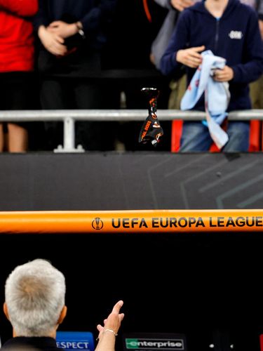 TOPSHOT - AS Roma's Portuguese coach Jose Mourinho throws his runners-up medal into the crowd after the UEFA Europa League final football match between Sevilla FC and AS Roma at the Puskas Arena in Budapest on May 31, 2023. (Photo by Odd ANDERSEN / AFP) (Photo by ODD ANDERSEN/AFP via Getty Images)