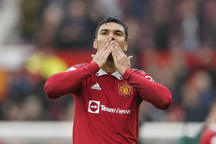 Manchester Uniteds Casemiro celebrates his teams 1-0 victory over Aston Villa at the end of the English Premier League soccer match between Manchester United and Aston Villa at the Old Trafford stadium in Manchester, England, Sunday, April 30, 2023. (AP Photo/Dave Thompson)