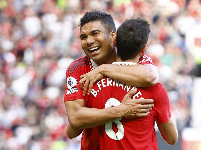 Soccer Football - Premier League - Manchester United v Fulham - Old Trafford, Manchester, Britain - May 28, 2023 Manchester United's Bruno Fernandes celebrates scoring their second goal with Casemiro Action Images via Reuters/Andrew Boyers EDITORIAL USE ONLY. No use with unauthorized audio, video, data, fixture lists, club/league logos or 'live' services. Online in-match use limited to 75 images, no video emulation. No use in betting, games or single club /league/player publications.  Please contact your account representative for further details.