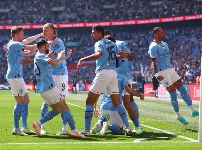 Soccer Football - FA Cup Final - Manchester City v Manchester United - Wembley Stadium, London, Britain - June 3, 2023 Manchester City's Ilkay Gundogan celebrates scoring their first goal with Rodri, Kyle Walker and teammates Action Images via Reuters/Paul Childs
