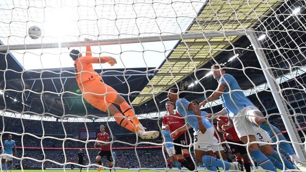 Manchester City's German goalkeeper Stefan Ortega (C) makes a save during the English FA Cup final football match between Manchester City and Manchester United at Wembley stadium, in London, on June 3, 2023. (Photo by Glyn KIRK / AFP) / NOT FOR MARKETING OR ADVERTISING USE / RESTRICTED TO EDITORIAL USE (Photo by GLYN KIRK/AFP via Getty Images)