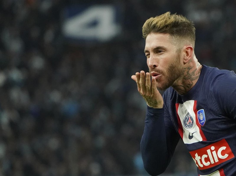 PSG's Sergio Ramos celebrates after scoring his side's opening goal during the French Cup soccer match between Olympique de Marseille and Paris Saint Germain at the Velodrome stadium in Marseille, southern France, Wednesday, Feb. 8, 2023. (AP Photo/Laurent Cipriani)