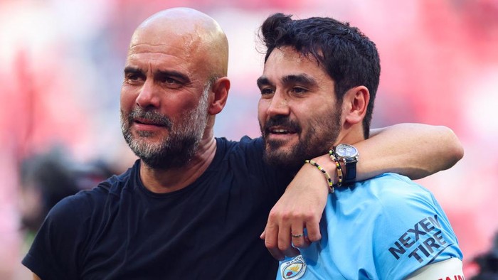 LONDON, ENGLAND - JUNE 3: Pep Guardiola manager of Manchester City celebrates with Ilkay Gundogan after the Emirates FA Cup Final match between Manchester City and Manchester United at Wembley Stadium on June 3, 2023 in London, England. (Photo by Marc Atkins/Getty Images)