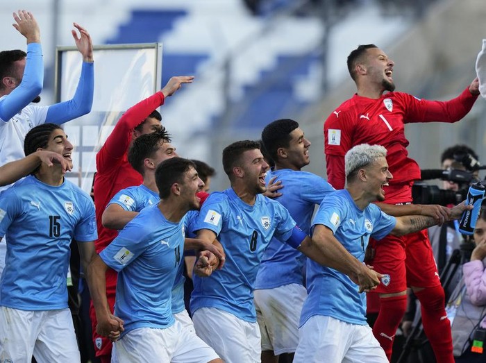 Israel players celebrate their team's 3-2 victory over Brazil at the end of a FIFA U-20 World Cup quarterfinal soccer match,  at the Bicentenario stadium in San Juan, Argentina, Saturday, June 3, 2023. (AP Photo/Natacha Pisarenko)