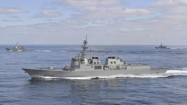 In this photo provided by South Korea Defense Ministry, South Korean Navy's Aegis destroyer King Sejong the Great, front, sails with U.S. Navy's Arleigh Burke-class guided-missile destroyer USS Barry, left, and Japan Maritime Self-Defense Force's destroyer Atago, right, during a joint missile defense drill between South Korea, the United States and Japan in the international waters of the east coast of Korean peninsular, Wednesday, Feb. 22, 2023. (South Korea Defense Ministry via AP)