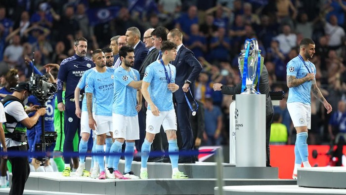 PORTO, PORTUGAL - MAY 29: John Stones of Manchester City and team mates receive their runners up medals following defeat in the UEFA Champions League Final between Manchester City and Chelsea FC at Estadio do Dragao on May 29, 2021 in Porto, Portugal. (Photo by Matt McNulty - Manchester City/Manchester City FC via Getty Images)