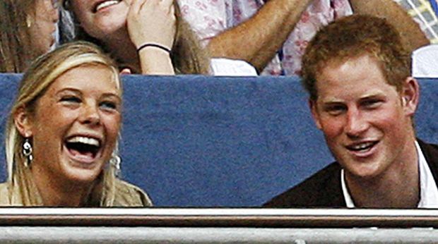 Prince Harry (R) and his girlfriend Chelsy Davy joke as they watch a performance at Wembley stadium in north London, 01 July 2007, as 60,000 revellers join Princes William and Harry for the six-hour long extravaganza in memory of their late mother Diana. Prince William, who turned 25 on June 21, predicted it would be 