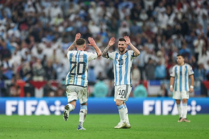 LUSAIL CITY, QATAR - DECEMBER 18: Lionel Messi of Argentina celebrates with Alexis Mac Allister after scoring the teams third goal during the FIFA World Cup Qatar 2022 Final match between Argentina and France at Lusail Stadium on December 18, 2022 in Lusail City, Qatar. (Photo by Maja Hitij - FIFA/FIFA via Getty Images)