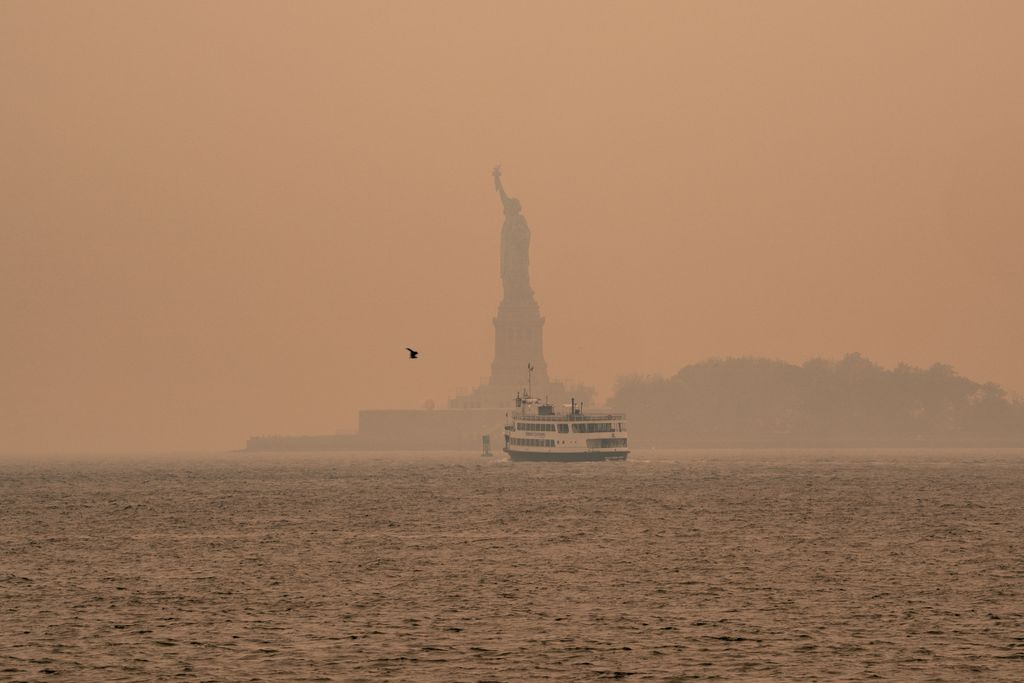 NEW YORK, NEW YORK - JUNE 7: A person waiting for the subway wears a filtered mask as smoky haze from wildfires in Canada blankets a neighborhood on June 7, 2023 in the Bronx borough of New York City. New York topped the list of most polluted major cities in the world on Tuesday night, as smoke from the fires continues to blanket the East Coast. (Photo by David Dee Delgado/Getty Images)