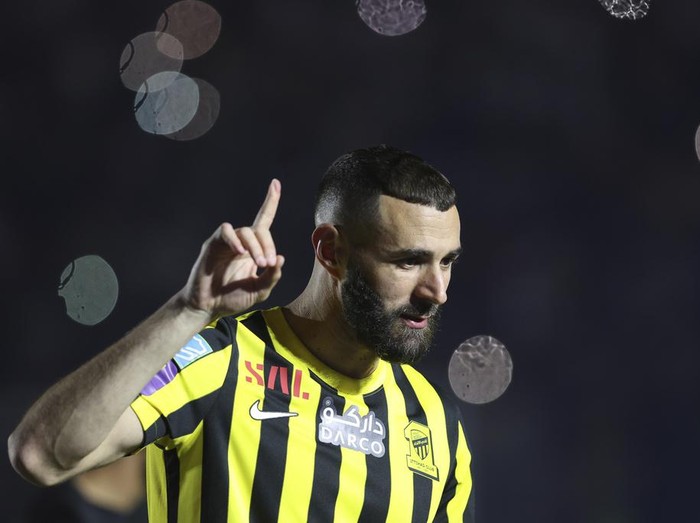 Saudi soccer team Al Ittihad player Karim Benzema greets Saudi fans during his presentation ceremony at King Abdullah Sports City Stadium in Jeddah, Saudi Arabia, Thursday, June 8, 2023. Benzema, who left Real Madrid after 14 years and 648 games, is set to play against his former Madrid teammate Cristiano Ronaldo, who joined Al-Nassr in January. (AP Photo)