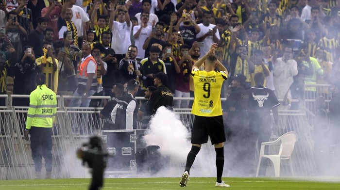 Saudi soccer team Al Ittihad player Karim Benzema greets Saudi fans during his presentation ceremony at King Abdullah Sports City Stadium in Jeddah, Saudi Arabia, Thursday, June 8, 2023. Benzema, who left Real Madrid after 14 years and 648 games, is set to play against his former Madrid teammate Cristiano Ronaldo, who joined Al-Nassr in January. (AP Photo)