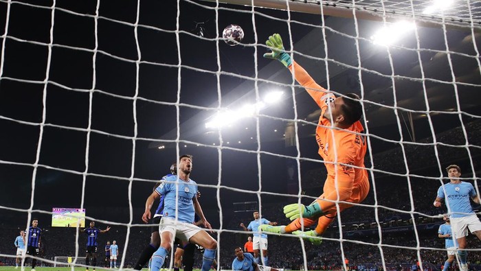 ISTANBUL, TURKEY - JUNE 10: (EDITORS NOTE: In this photo taken from a remote camera from behind the goal.) Federico Dimarco (obscured) of FC Internazionale hits the crossbar with a header as Ederson of Manchester City dives during the UEFA Champions League 2022/23 final match between FC Internazionale and Manchester City FC at Atatuerk Olympic Stadium on June 10, 2023 in Istanbul, Turkey. (Photo by Michael Steele/Getty Images)