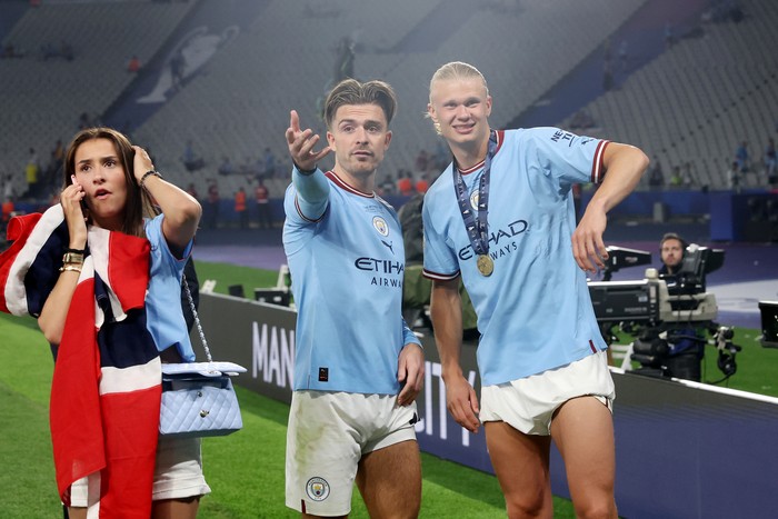 ISTANBUL, TURKEY - JUNE 10: Jack Grealish and Erling Haaland of Manchester City celebrate after the team's victory in the UEFA Champions League 2022/23 final match between FC Internazionale and Manchester City FC at Atatuerk Olympic Stadium on June 10, 2023 in Istanbul, Turkey. (Photo by Alexander Hassenstein - UEFA/UEFA via Getty Images)
