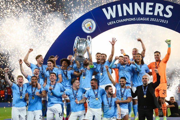 ISTANBUL, TURKEY - JUNE 10:  Ilkay Gundogan of Manchester City lifts the trophy and celebrates with teammates after the UEFA Champions League 2022/23 final match between FC Internazionale and Manchester City FC at Atatuerk Olympic Stadium on June 10, 2023 in Istanbul, Turkey. (Photo by Craig Mercer/MB Media/Getty Images)
