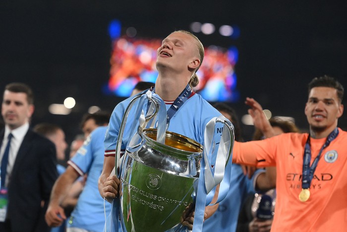 TOPSHOT - Manchester Citys Norwegian striker #9 Erling Haaland celebrates with the European Cup trophy after winning the UEFA Champions League final football match between Inter Milan and Manchester City at the Ataturk Olympic Stadium in Istanbul, on June 10, 2023. (Photo by FRANCK FIFE / AFP) (Photo by FRANCK FIFE/AFP via Getty Images)