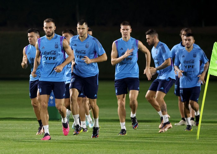 DOHA, QATAR - DECEMBER 15: German Pezzella, Guido Rodriguez, Juan Foyth of Argentina and teammates during a training session ahead of the World Cup Final at Qatar University training center 3 on December 15, 2022 in Doha, Qatar. (Photo by Jean Catuffe/Getty Images)
