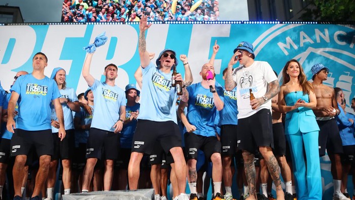 MANCHESTER, ENGLAND - JUNE 12: Kalvin Phillips of Manchester City celebrates on stage with a beer during the Manchester City trophy parade on June 12, 2023 in Manchester, England. (Photo by Isaac Parkin - MCFC/Manchester City FC via Getty Images)