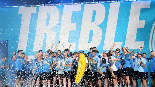 Manchester City Manchester City players celebrate on stage with their trophies during the Treble Parade in Manchester. Manchester City completed the treble (Champions League, Premier League and FA Cup) after a 1-0 victory over Inter Milan in Istanbul secured them Champions League glory. Picture date: Monday June 12, 2023. (Photo by Nigel French/PA Images via Getty Images)