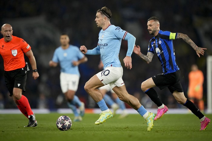 Manchester City's Jack Grealish controls the ball next to Inter Milan's Marcelo Brozovic during the Champions League final soccer match between Manchester City and Inter Milan at the Ataturk Olympic Stadium in Istanbul, Turkey, Saturday, June 10, 2023. (AP Photo/Emrah Gurel)
