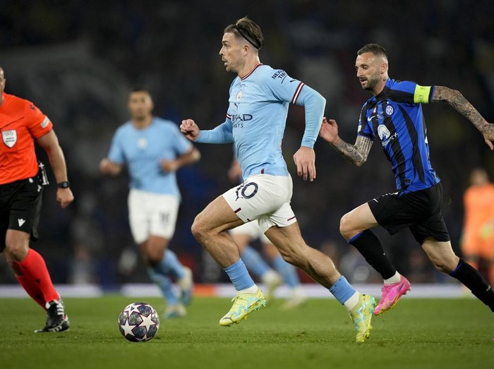 Manchester City's Jack Grealish controls the ball next to Inter Milan's Marcelo Brozovic during the Champions League final soccer match between Manchester City and Inter Milan at the Ataturk Olympic Stadium in Istanbul, Turkey, Saturday, June 10, 2023. (AP Photo/Emrah Gurel)