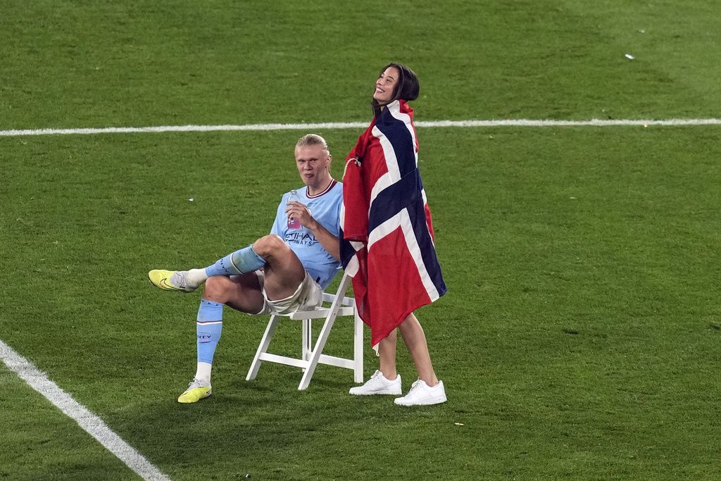 Manchester City's Erling Haaland poses with the trophy after winning the Champions League final soccer match between Manchester City and Inter Milan at the Ataturk Olympic Stadium in Istanbul, Turkey, Sunday, June 11, 2023. Manchester City won 1-0. (AP Photo/Francisco Seco)