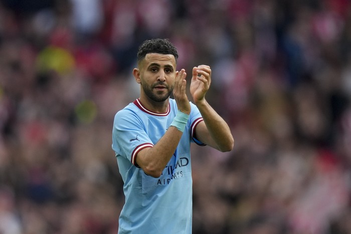 Manchester Citys Riyad Mahrez greets fans at the end of the English FA Cup semi final soccer match between Manchester City and Sheffield United at Wembley stadium, in London, Saturday, April 22, 2023. (AP Photo/Alastair Grant)