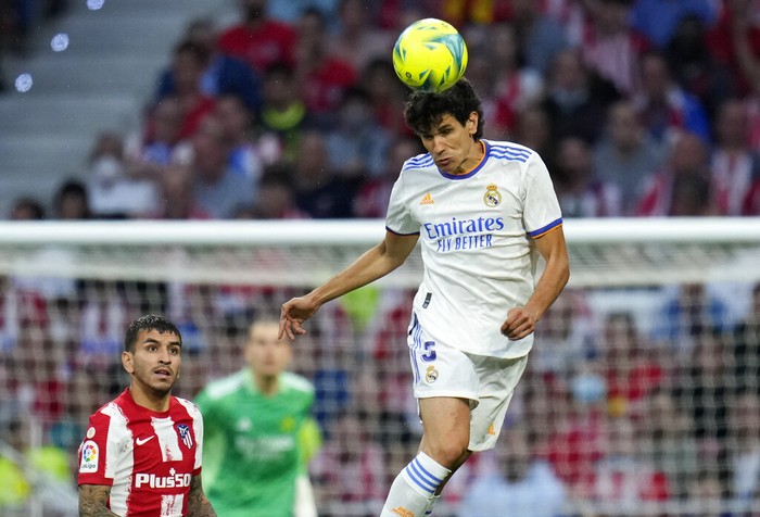 Real Madrid's Jesus Vallejo heads the ball during a Spanish La Liga soccer match between Atletico Madrid and Real Madrid at the Wanda Metropolitano stadium in Madrid, Spain, Sunday, May 8, 2022. (AP Photo/Manu Fernandez)