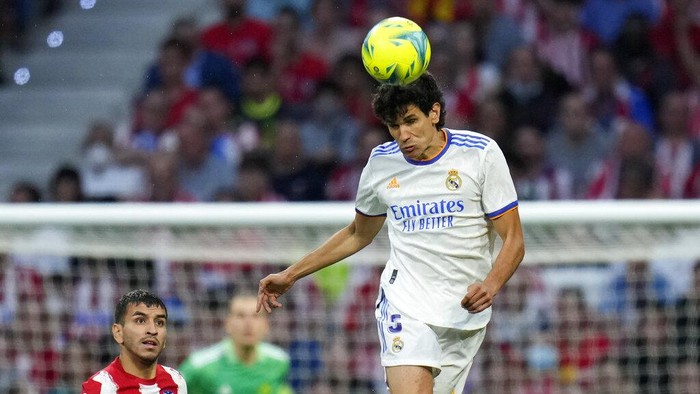 Real Madrid's Jesus Vallejo heads the ball during a Spanish La Liga soccer match between Atletico Madrid and Real Madrid at the Wanda Metropolitano stadium in Madrid, Spain, Sunday, May 8, 2022. (AP Photo/Manu Fernandez)