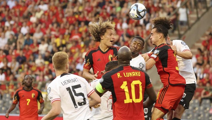 Belgiums Arthur Theate, second right, and Austrias David Alaba, third right, go up for the ball during the Euro 2024 group F qualifying soccer match between Belgium and Austria at the King Baudouin Stadium in Brussels, Saturday, June 17, 2023. (AP Photo/Geert Vanden Wijngaert)