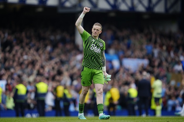Everton's goalkeeper Jordan Pickford gestures to fans at the end of the English Premier League soccer match between Everton and Manchester City at the Goodison Park stadium in Liverpool, England, Sunday, May 14, 2023. Manchester City won 3-0. (AP Photo/Jon Super)