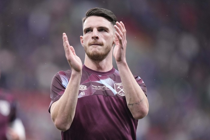 West Hams Declan Rice warms up prior to the start of the Europa Conference League final soccer match between Fiorentina and West Ham at the Eden Arena in Prague, Wednesday, June 7, 2023. (AP Photo/Darko Bandic)