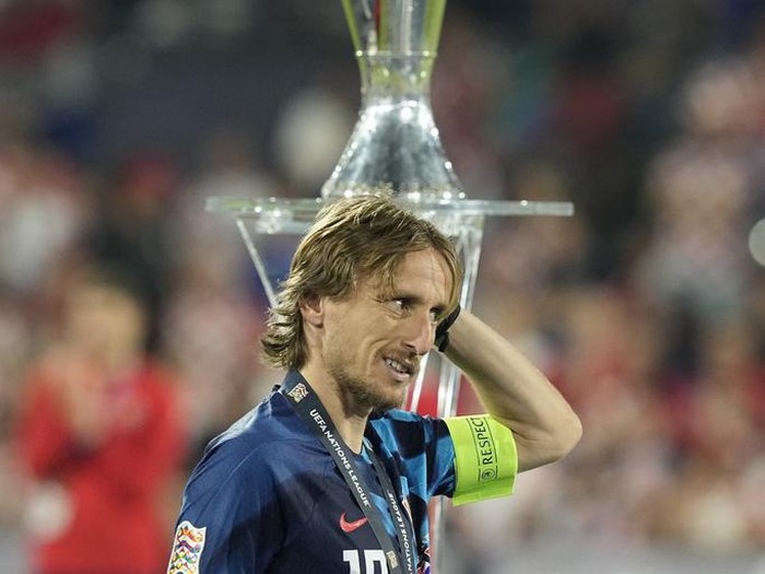 Croatia's Luka Modric walks past the trophy after the Nations League final soccer match between Croatia and Spain at De Kuip stadium in Rotterdam, Netherlands, Sunday, June 18, 2023. (AP Photo/Martin Meissner)