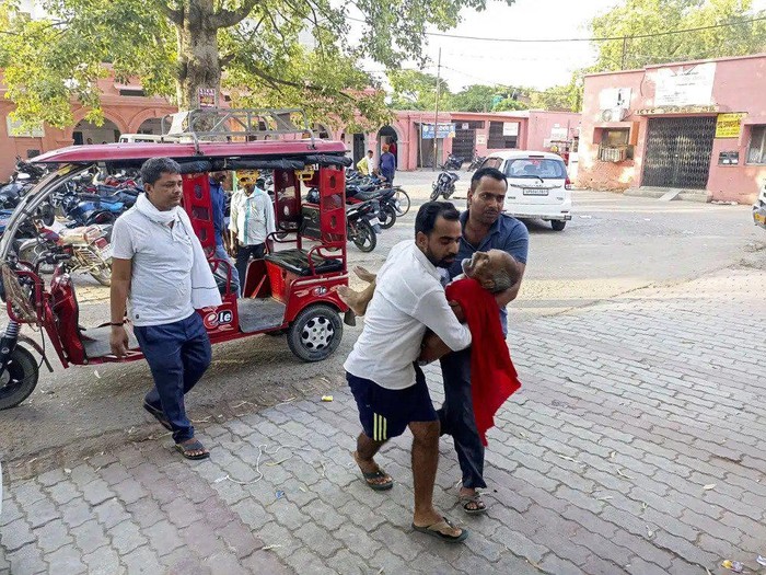 An elderly man is carried to a hospital in Ballia district, in northern Uttar Pradesh state, India, Sunday, June 18, 2023. Swaths of two of Indias most populous states are under a grip of sever heat leaving dozens of people dead in several days as authorities issue a warning to residents over 60 and others with ailments to stay indoors during the daytime. (AP Photo)