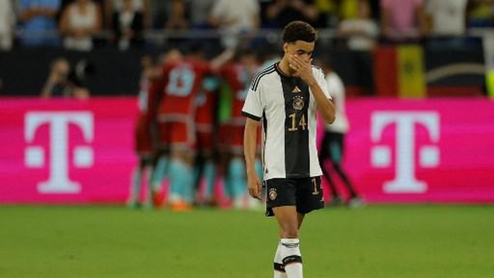 Germanys midfielder Jamal Musiala reacts after conciding during the international friendly football match between Germany and Colombia in Gelsenkirchen, western Germany on June 20, 2023. (Photo by Odd ANDERSEN / AFP)
